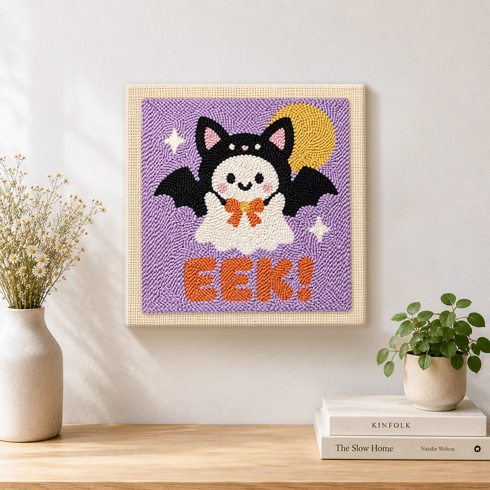 Finished bat costume ghost artwork displayed on a wall