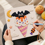 Creating handmade bat moon ice cream punch needle artwork