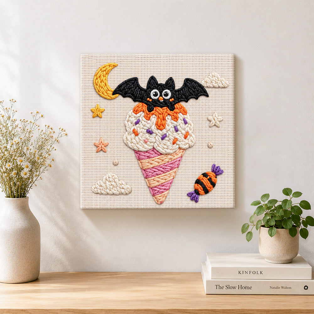Bat moon ice cream punch needle artwork displayed on a table