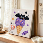Bat purple ice cream cone punch needle artwork displayed on a table