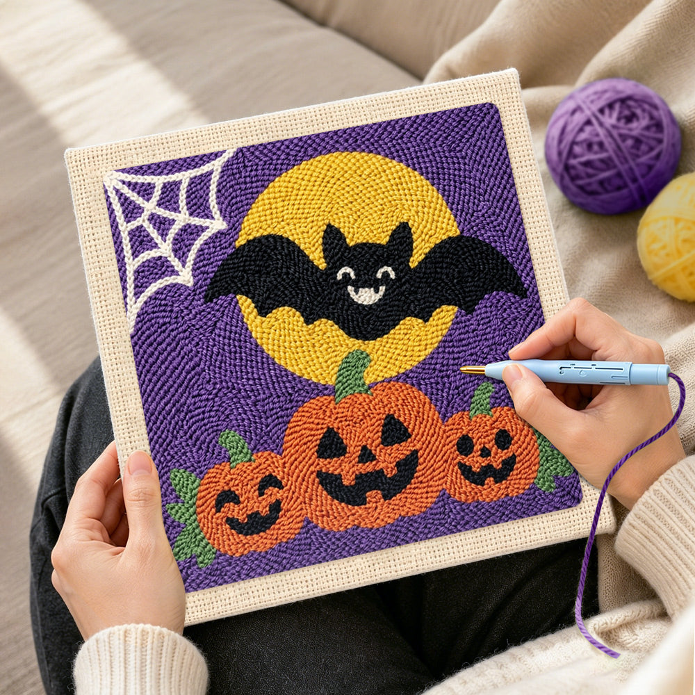 Creating handmade bat with pumpkins punch needle artwork
