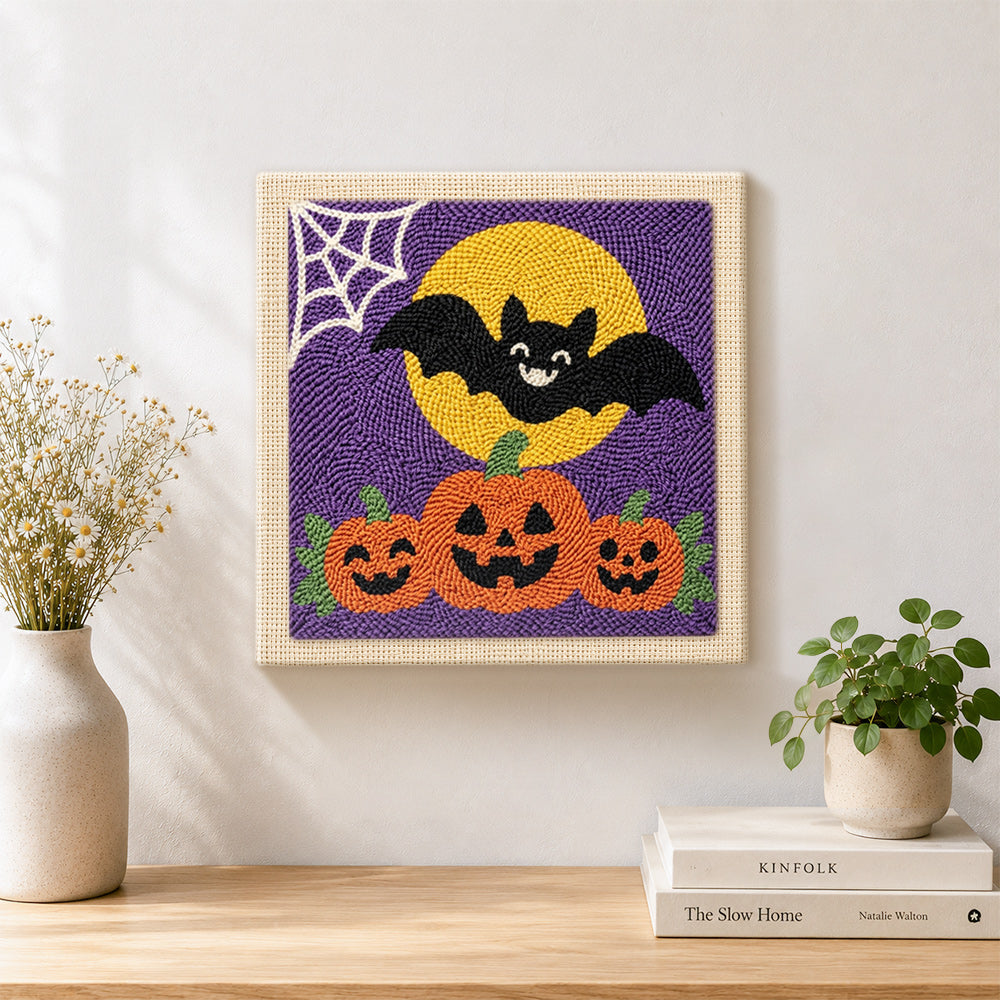 Finished bat with pumpkins artwork displayed on a wall