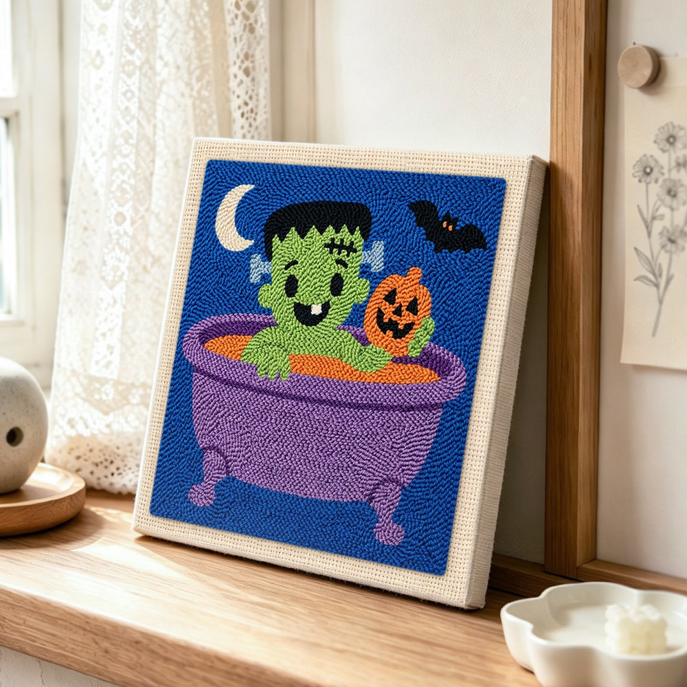 Bath time frankenstein punch needle artwork displayed on a table