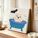 Bath time ghost punch needle artwork displayed on a table