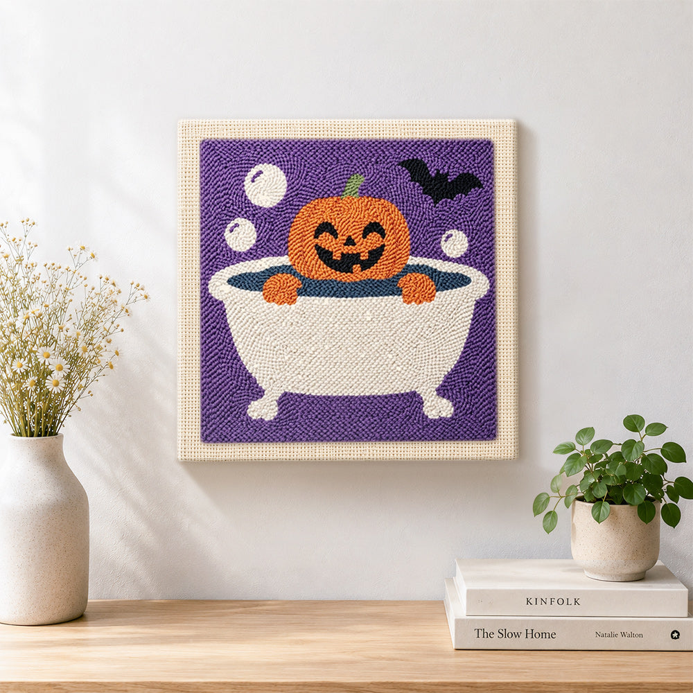 Finished bath time jack‑o‑lantern artwork displayed on a wall