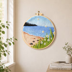 Beach daisies and blue sea needle felt wall art displayed in a bright home interior