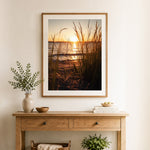 Finished beach grass silhouette at golden sunset cross stitch artwork displayed as home decor