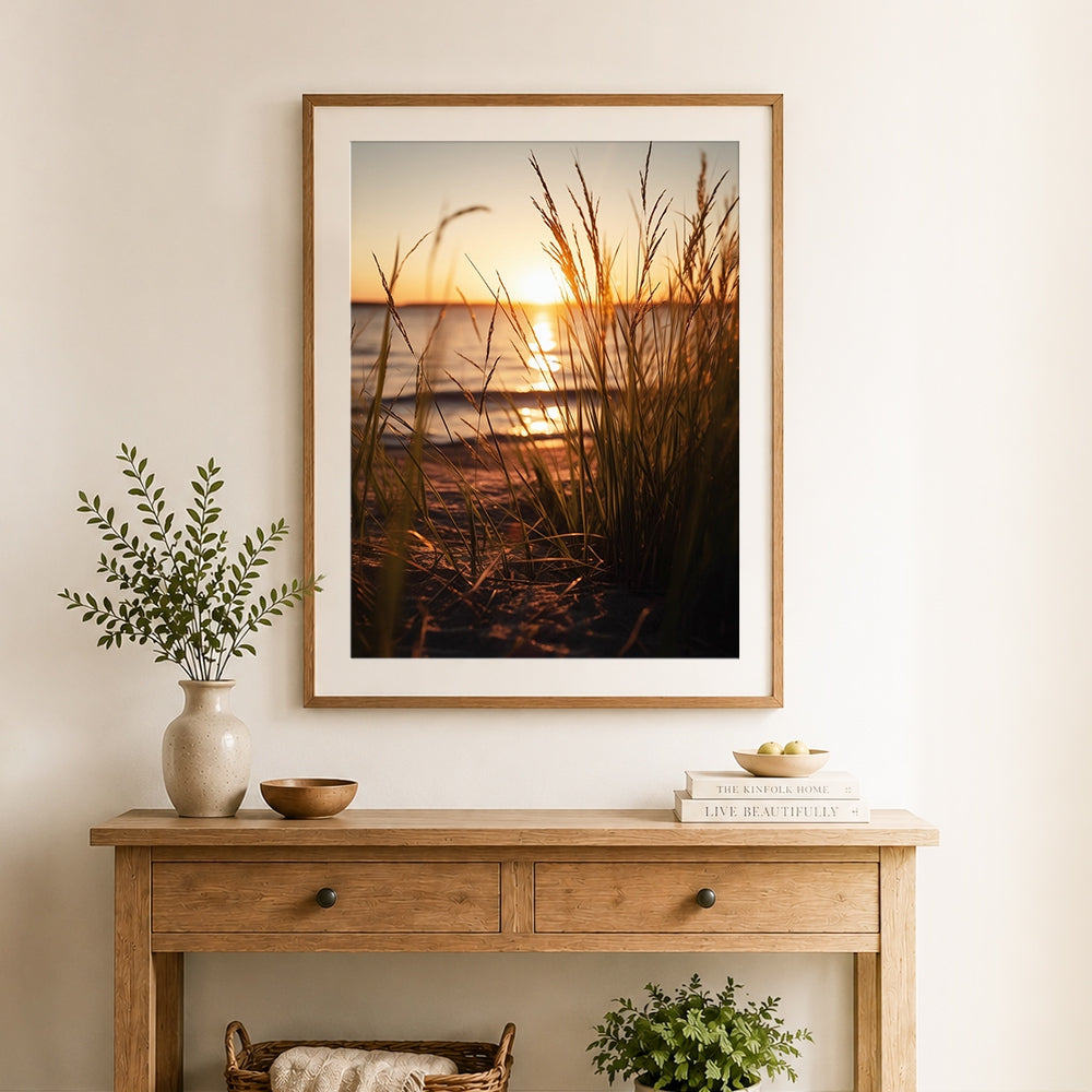 Finished beach grass silhouette at golden sunset cross stitch artwork displayed as home decor