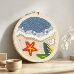 Beach seaside with starfish punch needle artwork displayed on a table