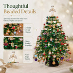 Close-up details of colorful crystal charms, beaded branches and pearl angel topper