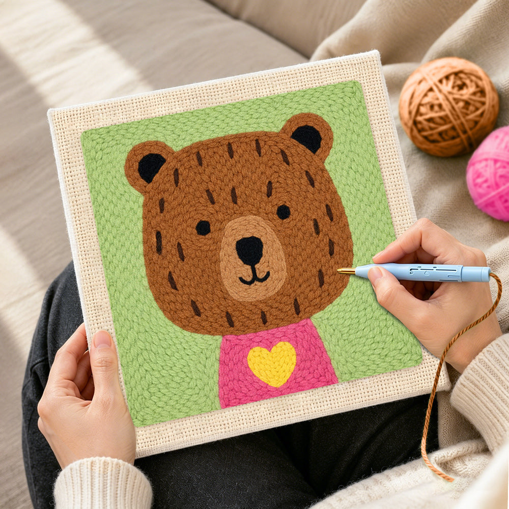 Creating handmade bear with yellow heart punch needle artwork