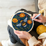 Creating handmade bee and orange flowers punch needle artwork