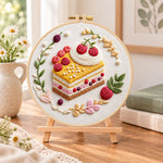 Berry slice delight embroidery kit finished hoop displayed on a wooden stand as cozy tabletop decor