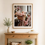 Finished bicycle flower basket cross stitch artwork displayed as home decor