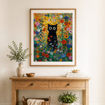 Finished big-eyed black cat among flowers cross stitch artwork displayed as home decor