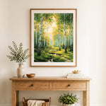 Finished birch trees along forest stream cross stitch artwork displayed as home decor