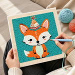 Creating handmade birthday party fox with cone hat punch needle artwork