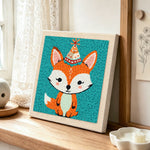 Birthday party fox with cone hat punch needle artwork displayed on a table