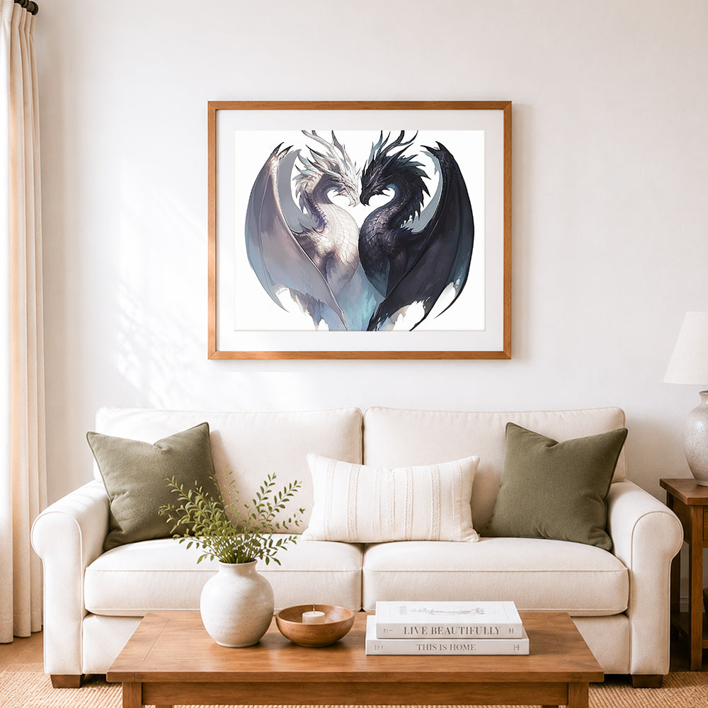 Finished black and white dragon heart form cross stitch artwork displayed as home decor