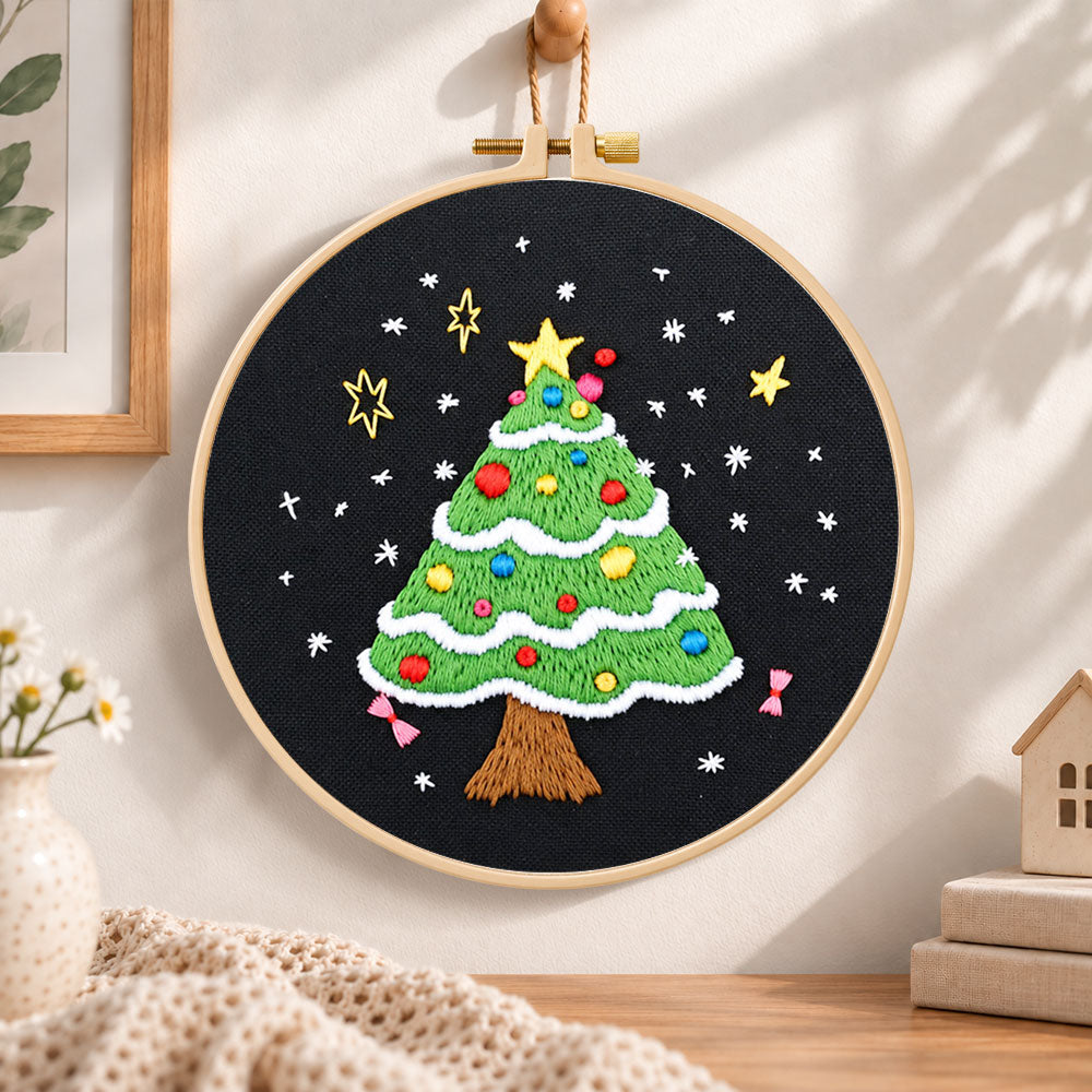 Black background tree embroidery hoop wall art displayed as warm and cozy handmade home decor