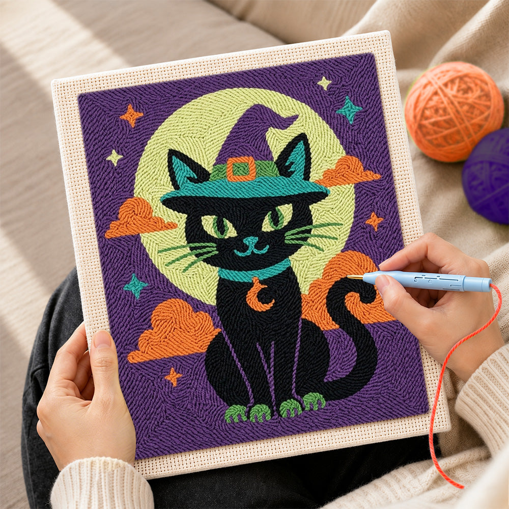 Creating handmade black cat beneath moon punch needle artwork