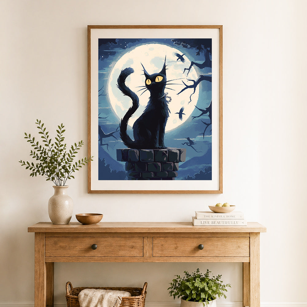 Finished black cat beneath the big moon cross stitch artwork displayed as home decor