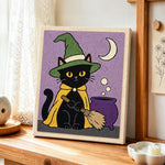 Black cat by magic cauldron punch needle artwork displayed on a table