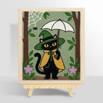 Black cat holding white umbrella punch needle kit for beginners