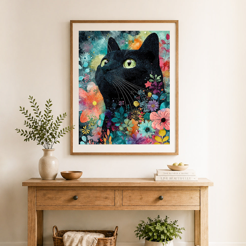 Finished black cat in floral bloom cross stitch artwork displayed as home decor