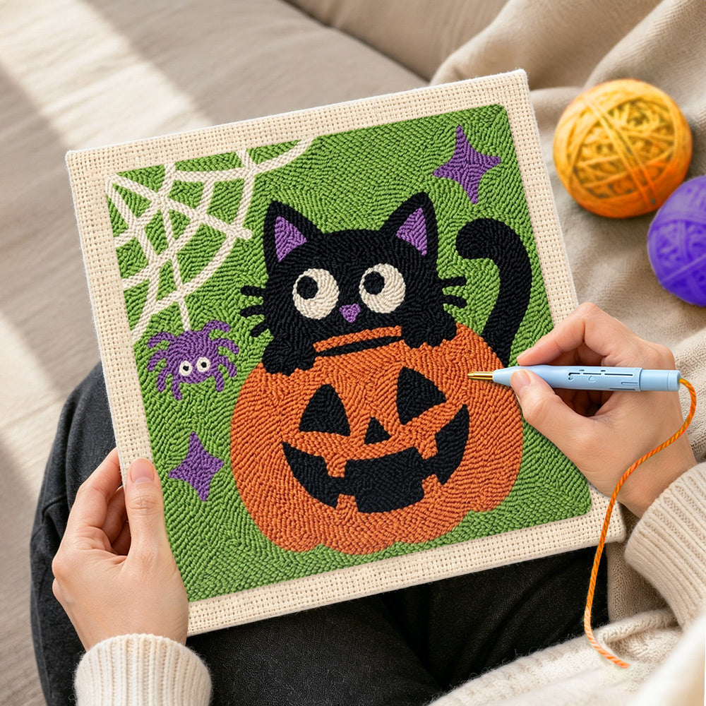 Creating handmade black cat in pumpkin punch needle artwork