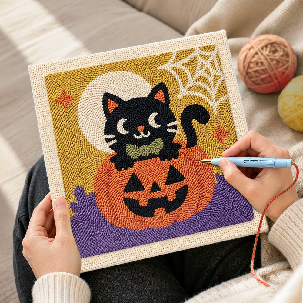 Creating handmade black cat on pumpkin punch needle artwork