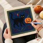 Creating handmade black cat pumpkin art punch needle artwork