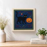 Finished black cat pumpkin art artwork displayed on a wall
