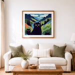 Finished black cats in stylized rolling hills cross stitch artwork displayed as home decor
