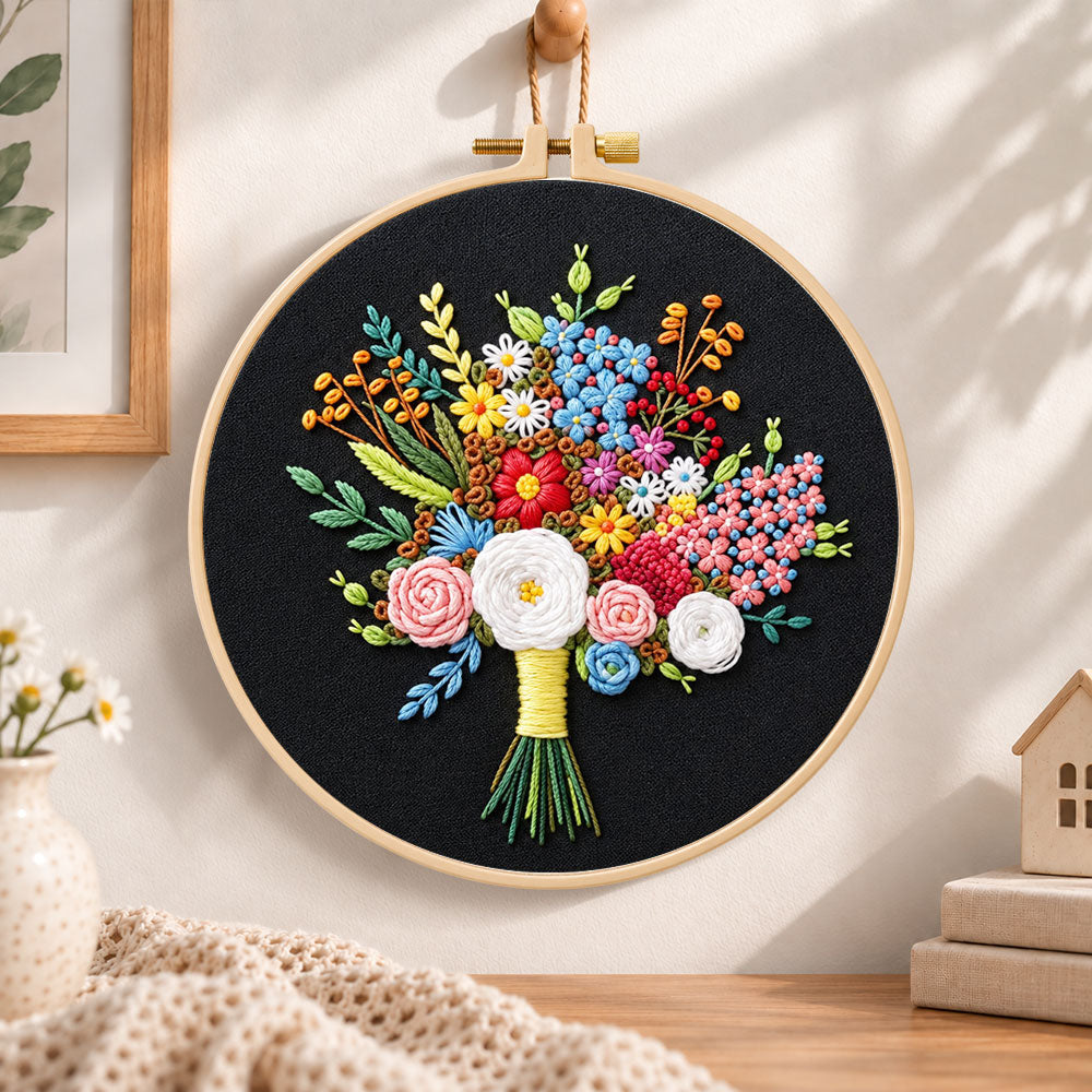 Black fabric flower bouquet embroidery hoop wall art displayed as warm and cozy handmade home decor