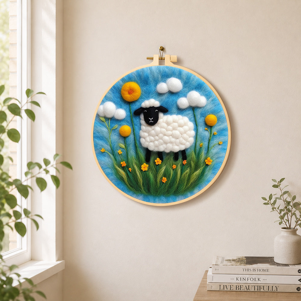 Black faced sheep with giant yellow flowers needle felt wall art displayed in a bright home interior