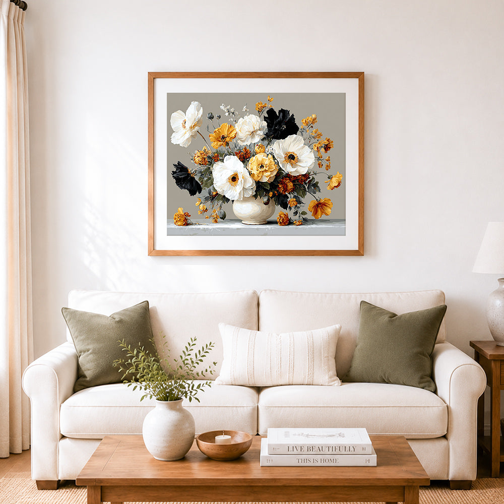 Finished black, white, and yellow bouquet cross stitch artwork displayed as home decor