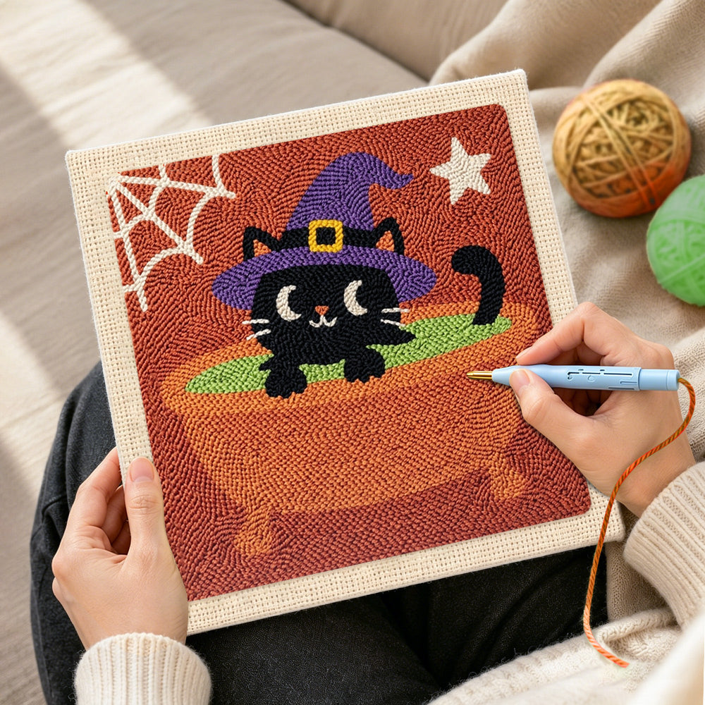 Creating handmade black witch cat in cauldron punch needle artwork
