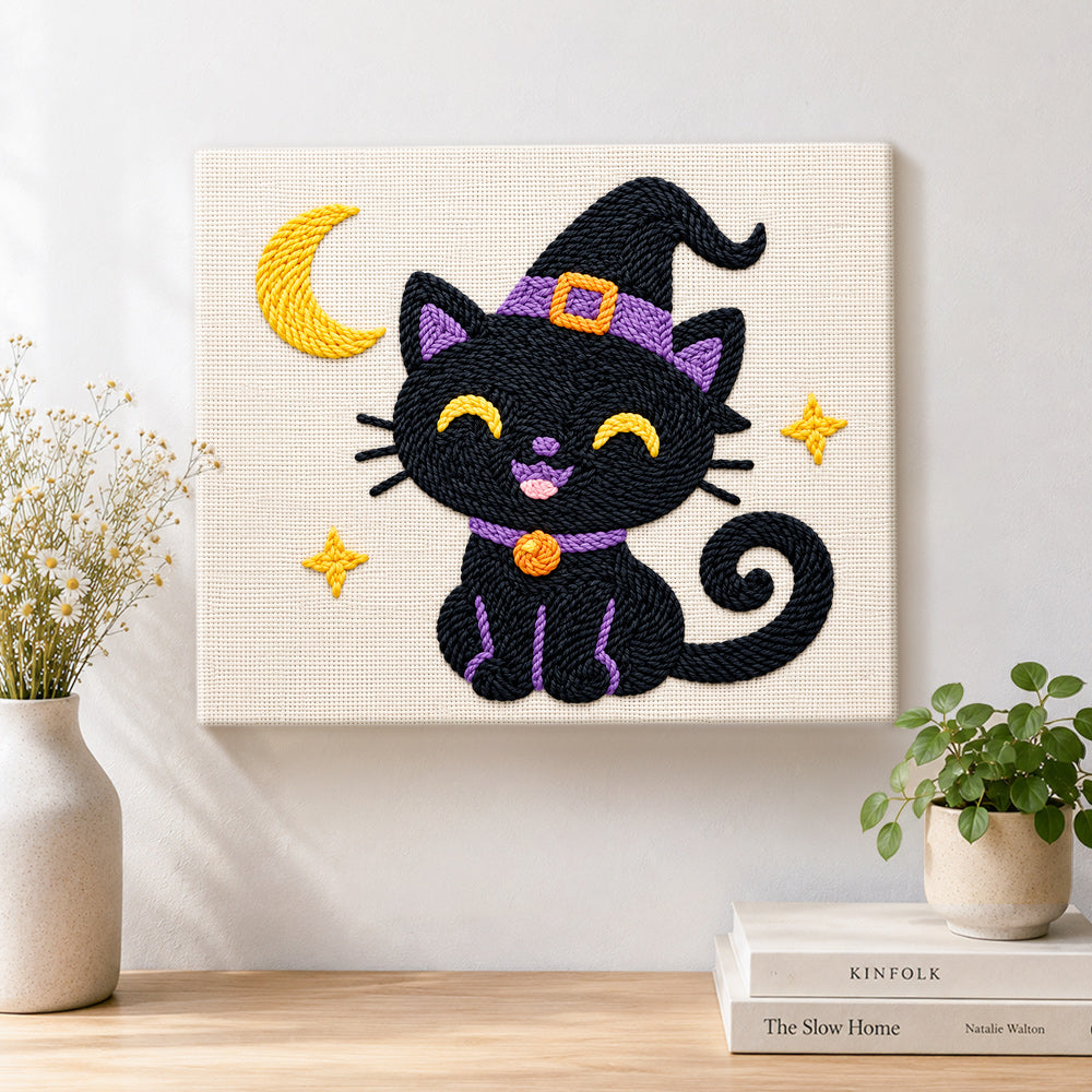Finished black witch cat with crescent moon artwork displayed on a wall