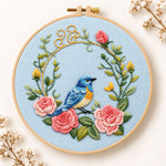 Blue bird inside pink rose wreath embroidery kit