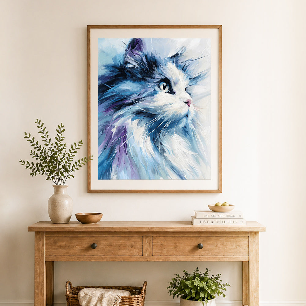 Finished blue brushstroke cat cross stitch artwork displayed as home decor