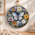 Blue butterfly in wildflower garden embroidery hoop wall art displayed as warm and cozy handmade home decor