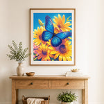 Finished blue butterfly on yellow daisies cross stitch artwork displayed as home decor