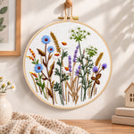 Blue cornflower meadow embroidery hoop wall art displayed as warm and cozy handmade home decor