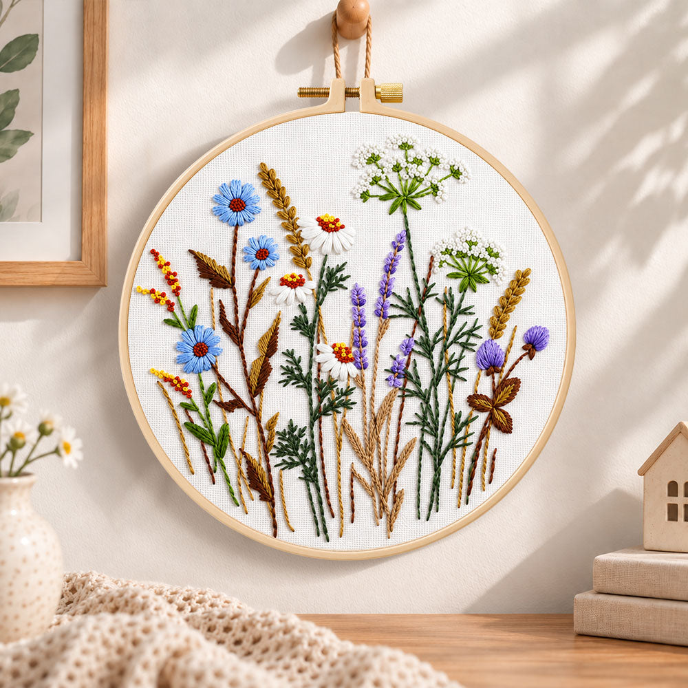 Blue cornflower meadow embroidery hoop wall art displayed as warm and cozy handmade home decor