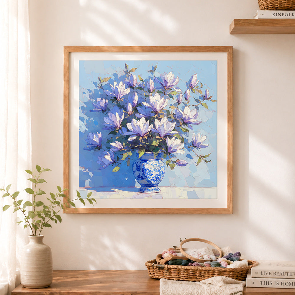 Finished blue magnolia bouquet cross stitch artwork displayed as home decor