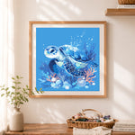 Finished blue ocean turtle cross stitch artwork displayed as home decor