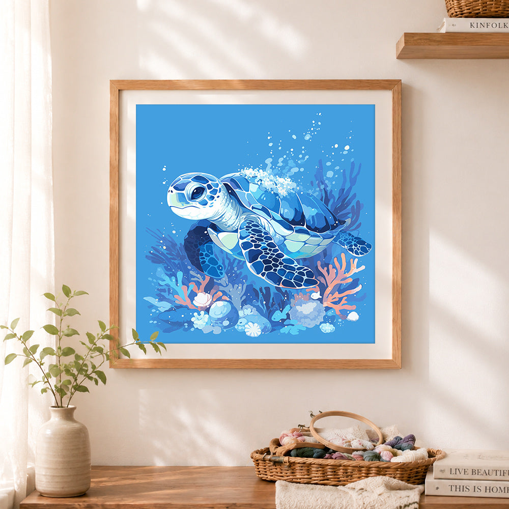 Finished blue ocean turtle cross stitch artwork displayed as home decor