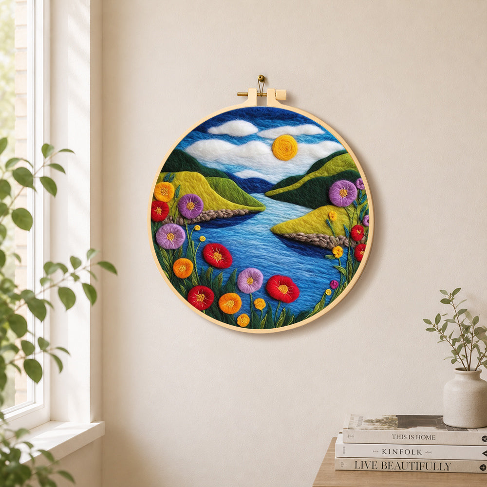 Blue river and enchanting poppies needle felt wall art displayed in a bright home interior