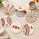 Boho sun, moon and mountain punch needle coasters used for home decoration